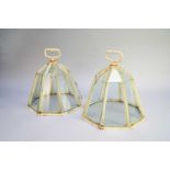 A pair of octagonal cast iron cloches