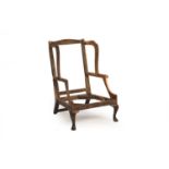 A Queen Anne period mahogany, oak and ash wing armchair frame