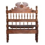 A recent carved wood bedstead, Mozambique