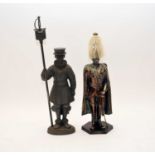 Two cast iron standing fireside figural tool caddies