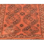 Two Afgham Bokara pattern rugs and another similar