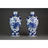 A pair of Chinese blue and white baluster vases, Kangxi marks but later