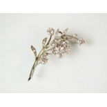 A rose cut diamond and cubic zirconia floral spray brooch