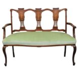 An Edwardian inlaid mahogany upholstered settee