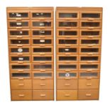 Two mid 20th century beech glazed haberdashery cabinets