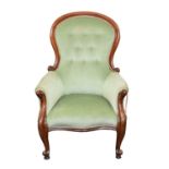 A Victorian mahogany button back armchair