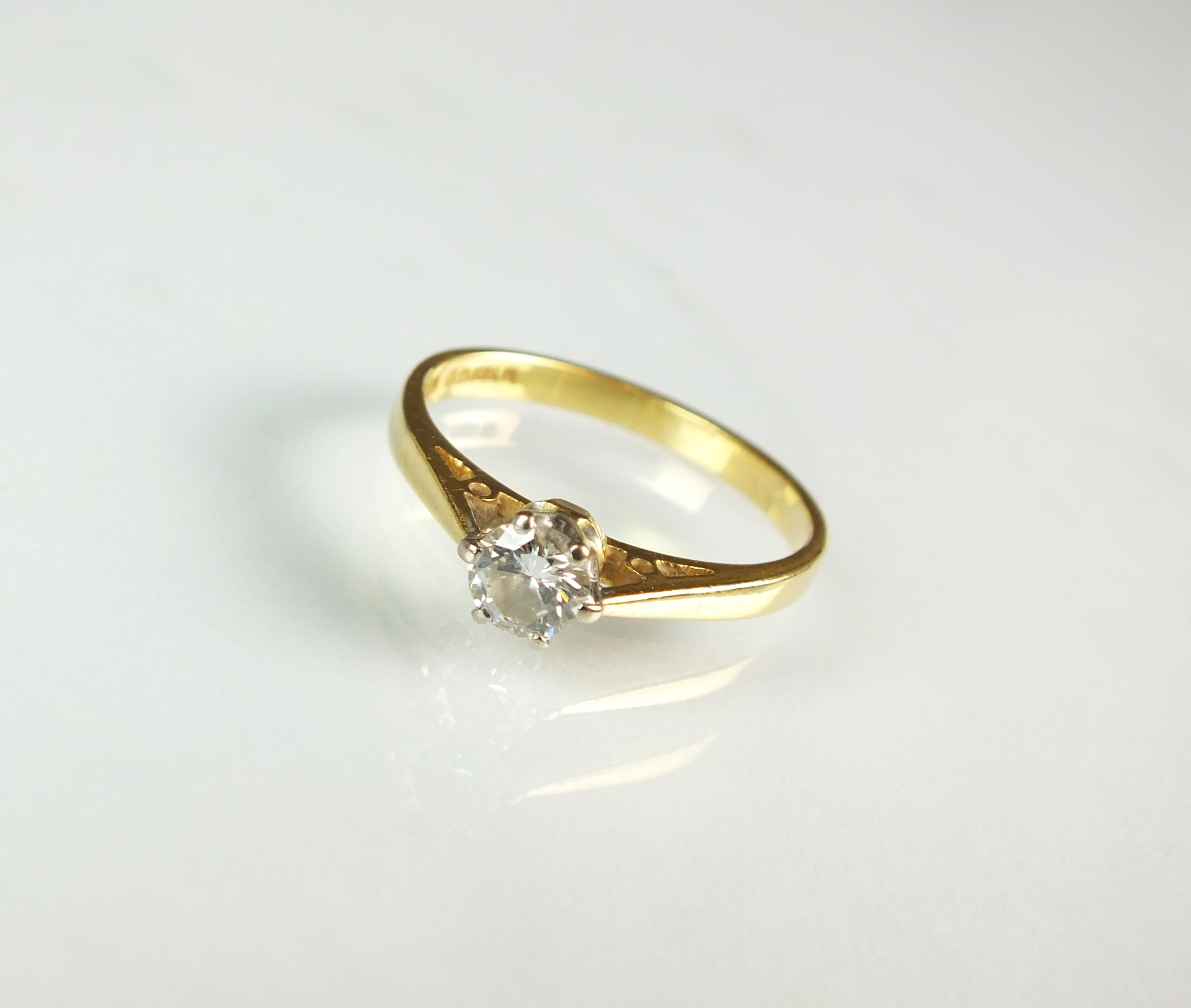 An 18ct gold single stone diamond ring