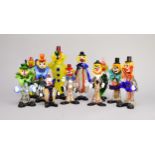 A group of 23 assorted Murano glass clowns, assorted poses, including three with portly bellies,