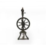 Two 19th century spinning wheels and a distaff