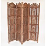 An Indian carved wood four fold room screen