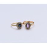 A sapphire and diamond oval cluster ring and an amethyst cluster ring