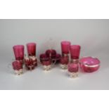 A collection of silver and Cranberry glass wares