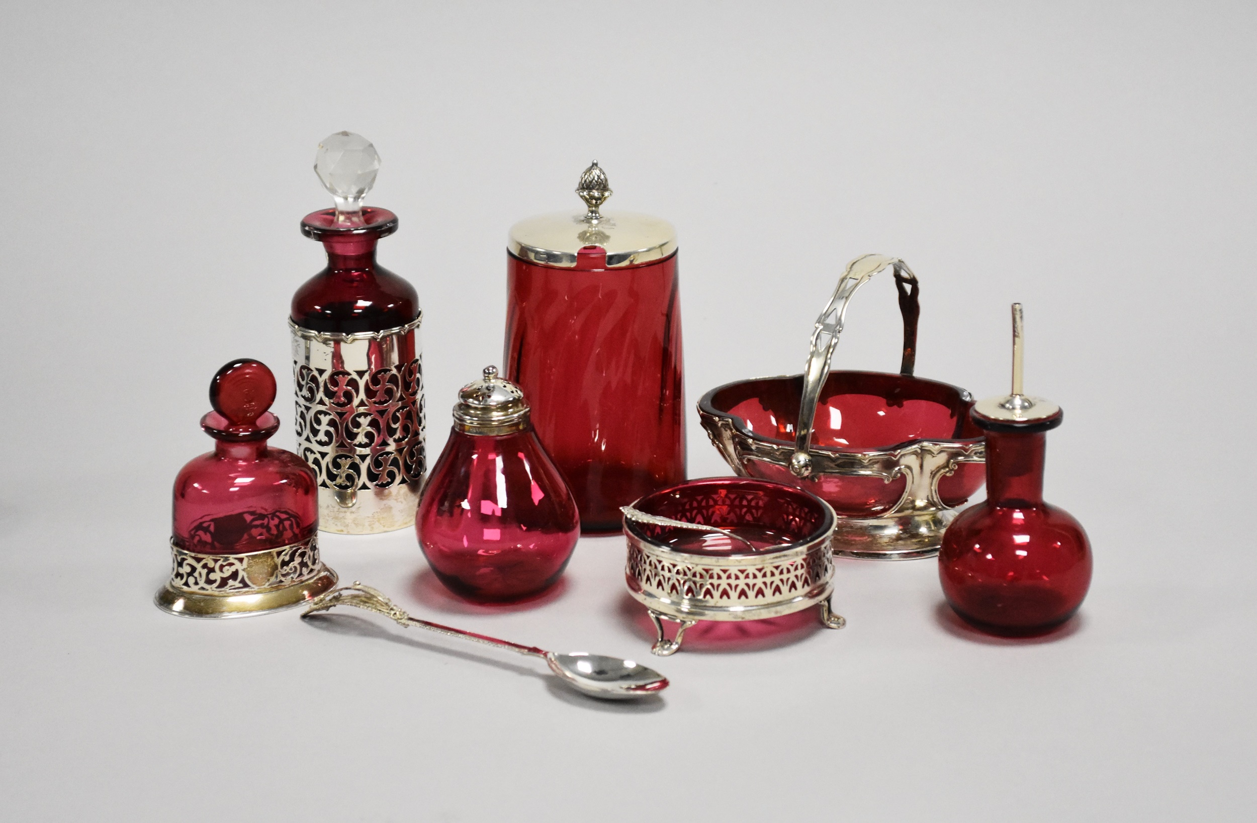 A collection of silver mounted cranberry glasswares