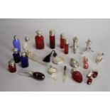 A collection of silver and white metal mounted glass miniature scent bottles