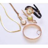 A 9ct gold bangle, a 9ct gold necklace and three watches
