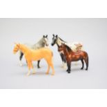 Four Beswick horses including an Appaloosa Stallion