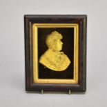 A gilt metal cameo portrait of George IV