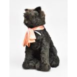 An early Merrythought black mohair seated cat