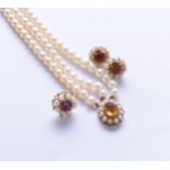A 9ct gold three strand uniform cultured pearl bracelet and earrings