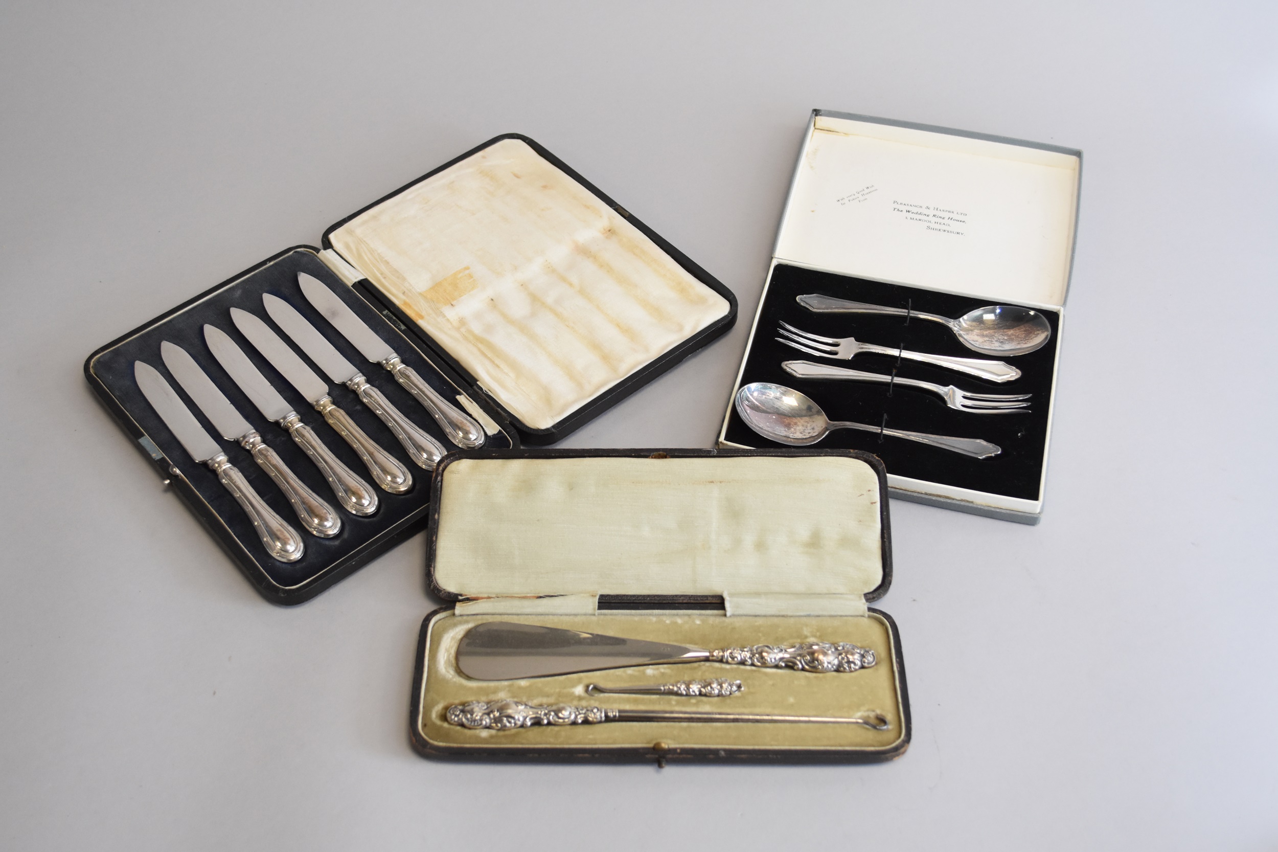 A cased set of six silver handled knives