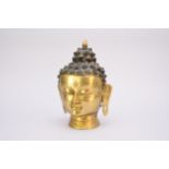 A recent Tiibetan bronze head of Buddha