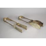 A pair of Victorian silver asparagus tongs