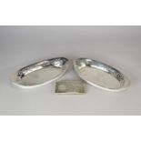 A pair of pierced silver dishes and a silver card case