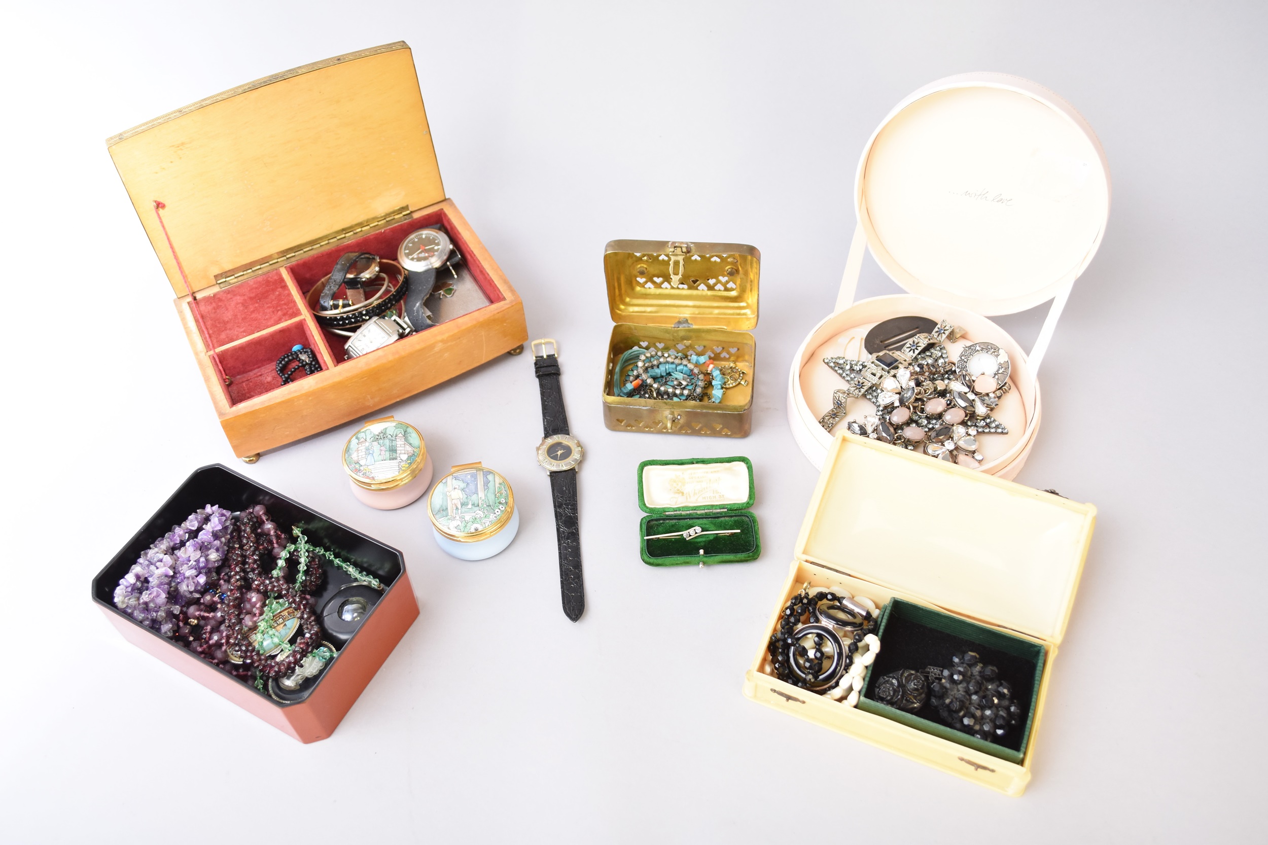 A collection of costume jewellery and watches