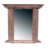 A Tibetan carved wood window frame converted to wall mirror