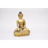A Sino Tibetan bronze seated Buddha