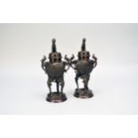 A pair of Japanese bronze koro and covers