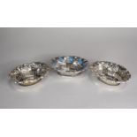 Three oval silver dishes