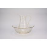 An Edwardian cut glass wash jug and basin