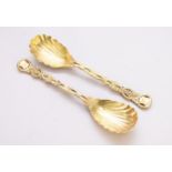 A pair of Victorian silver gilt 'Pierced Vine' pattern serving spoons by Hunt & Roskell