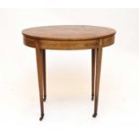 An Edwardian mahogany, oval occasional table