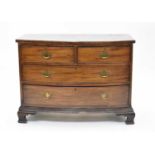 An early 19th century mahogany veneered bow-fronted chest of drawers