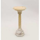 An alabaster bird table