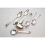 Three George III silver basting spoons, a plated soup ladle and a pair of plated salad servers