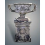 A large and impressive 19th century ceramic urn, modelled as the Warwick vase, on a pedestal (2)