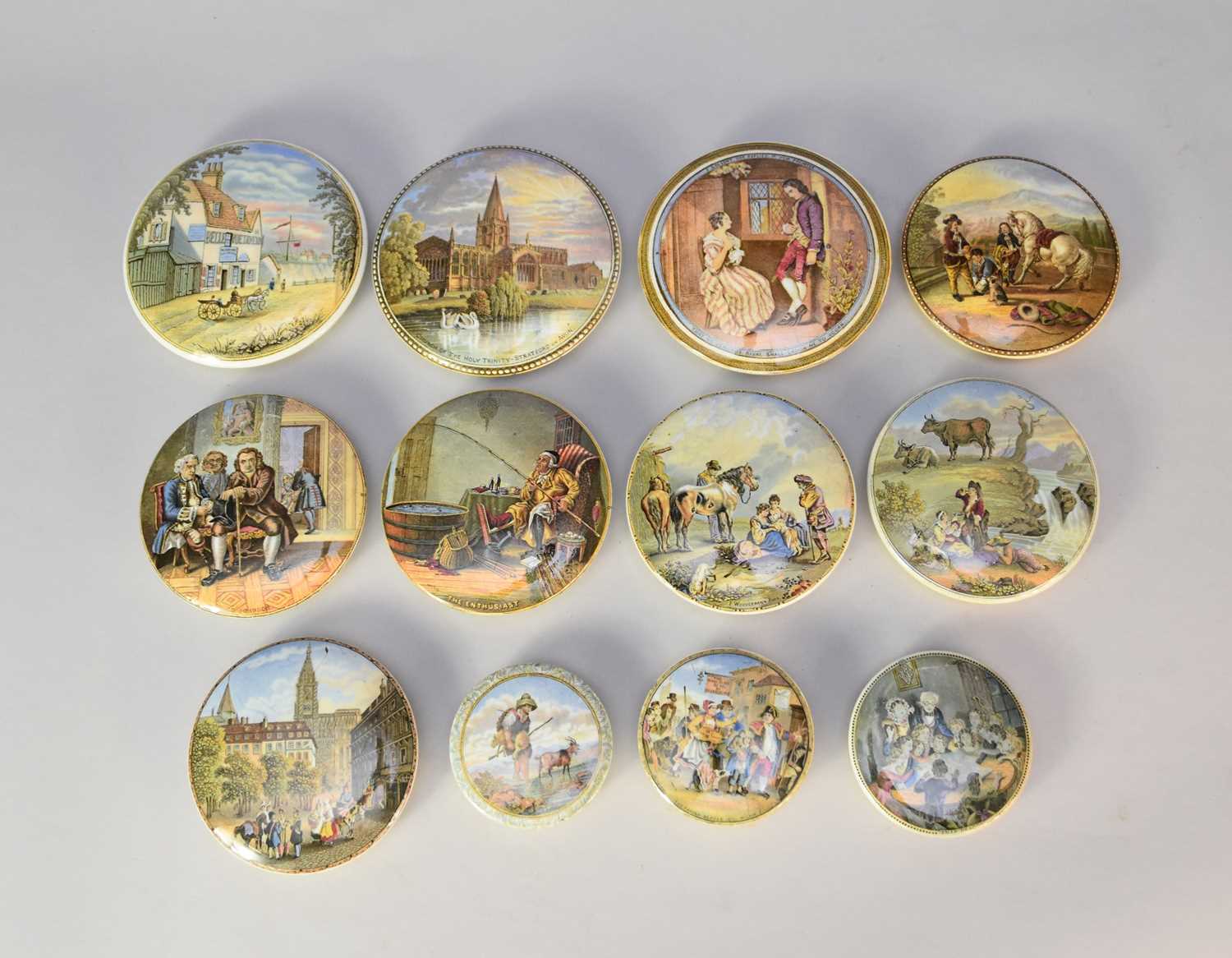 A collection of twelve prattware pot lids, unframed