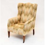 An Edwardian wing armchair