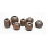 A group of seven lignum vitae horse tethering weights