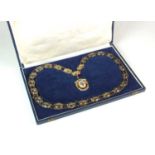 A 9ct gold and enamelled United Commercial Travellers association jewel