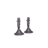 A pair of 19th century Coalbrookdale cast iron figural candlesticks, 19cm high