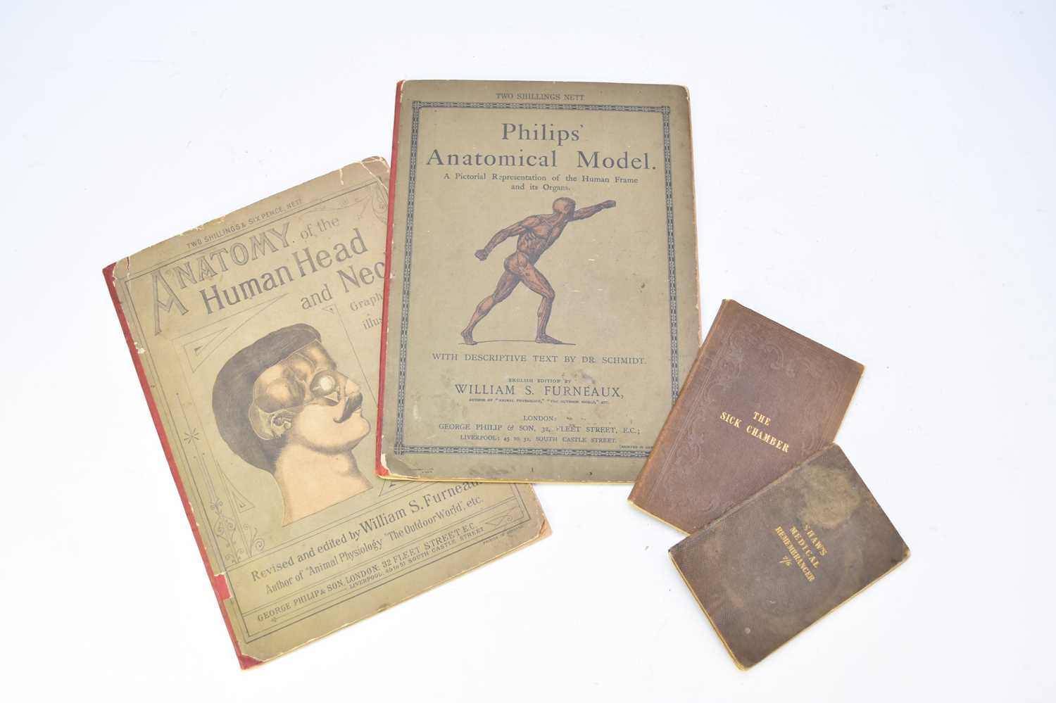 A collection of four early 20th century medical books including Philips' Anatomy