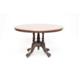 A Victorian inlaid walnut and mahogany tilt-top centre table