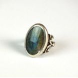 A silver single stone labradorite ring