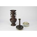 Two Japanese bronze vases and a Chinese porcelain candle holder
