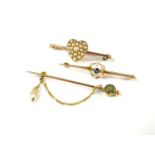 Two brooches and a stick pin