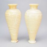 A pair of polished alabaster amphora vases